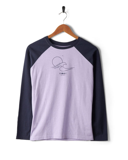 A Saltrock High Tides - Womens Raglan Long Sleeve T-Shirt in Light Purple and navy with a peached soft hand feel finish.