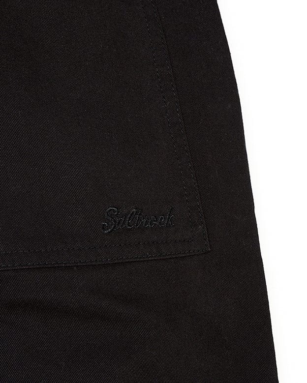 The back pocket of a Saltrock Hilda Twill - Womens Trouser - Black shorts with a logo on it.