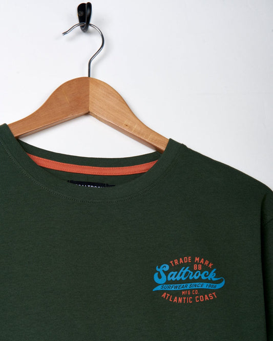 A green Saltrock Home Run - Mens Short Sleeve T-Shirt - Dark Green with a blue logo.