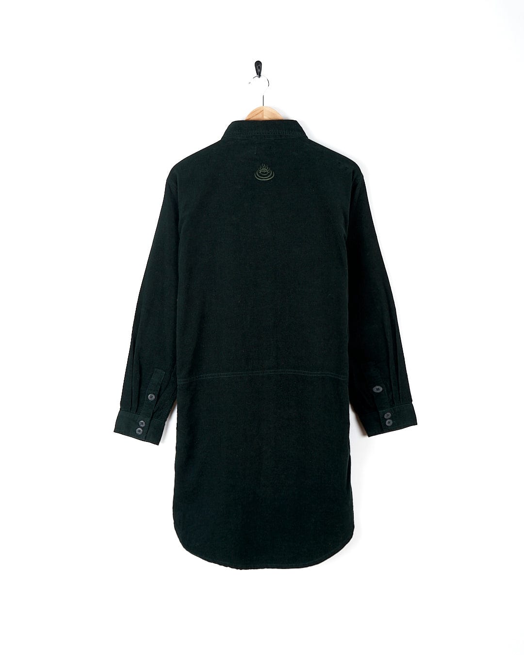 A dark green Iris - Cord Shirt Dress with Saltrock embroidery hanging on a hanger.