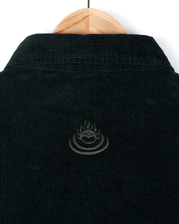 A Saltrock Iris - Cord Shirt Dress - Dark Green with a logo on the back.