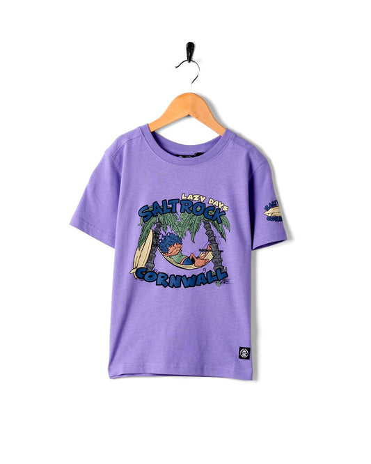 A Lazy Location Cornwall - Kids T-Shirt - Purple on a surfer in Cornwall by Saltrock.