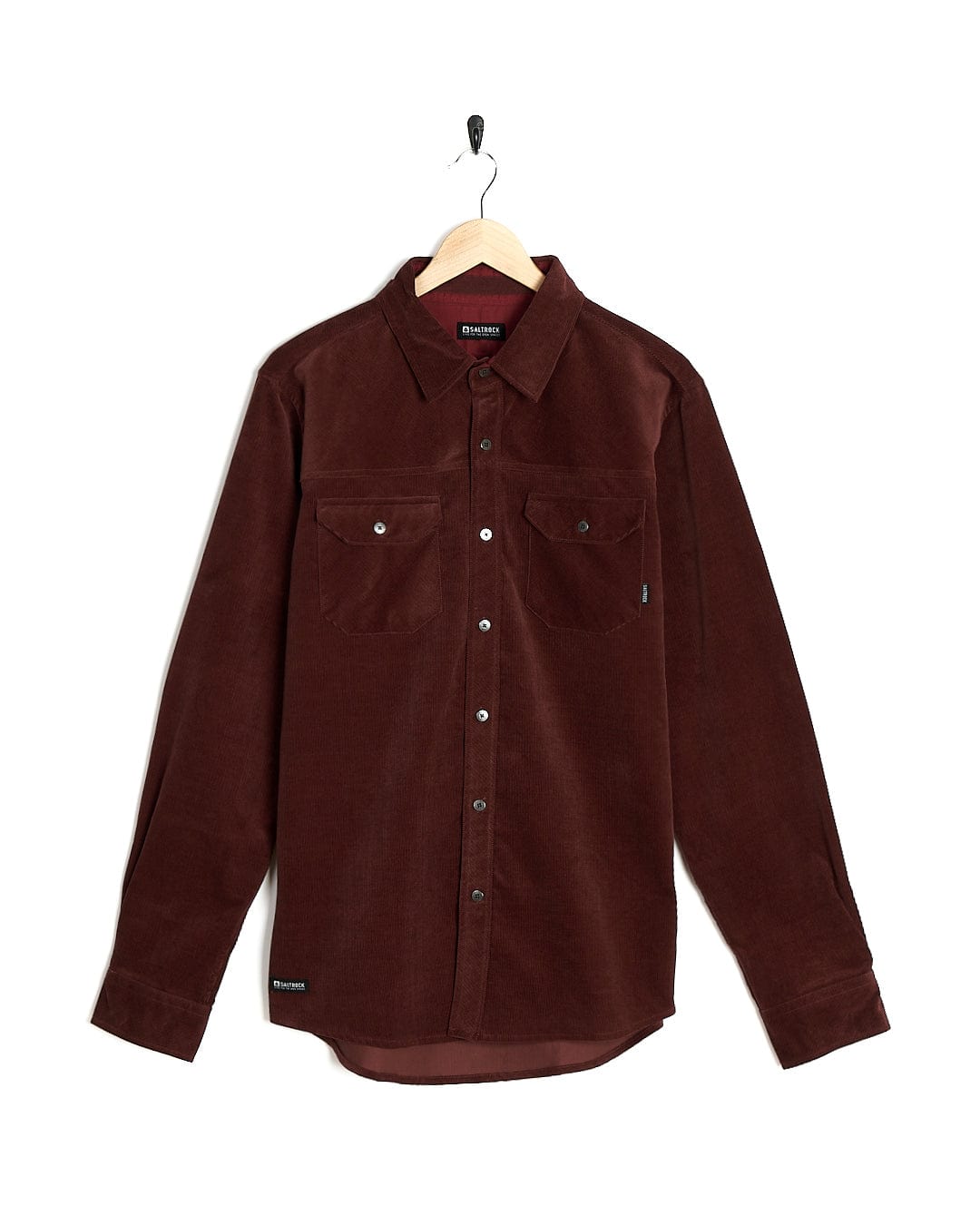 A Linus - Mens Long Sleeve Shirt - Dark Red by Saltrock hanging on a hanger.