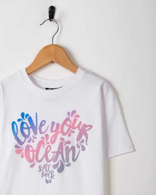 A 100% cotton white t-shirt that says Love Your Ocean Gradient with a floral slogan by Saltrock.