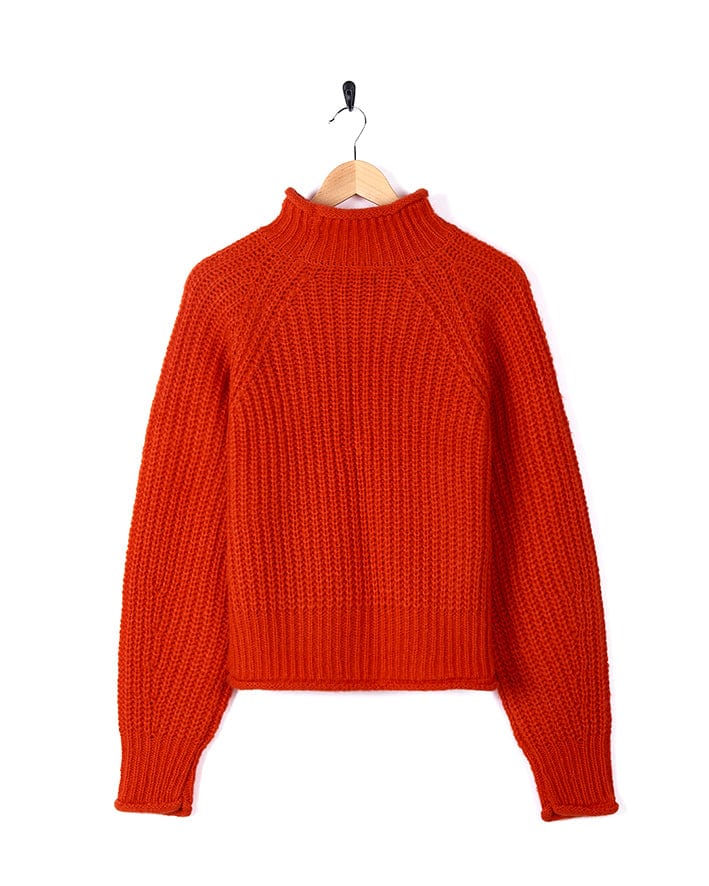 Mandy wearing a Saltrock red sweater with chunky knit.