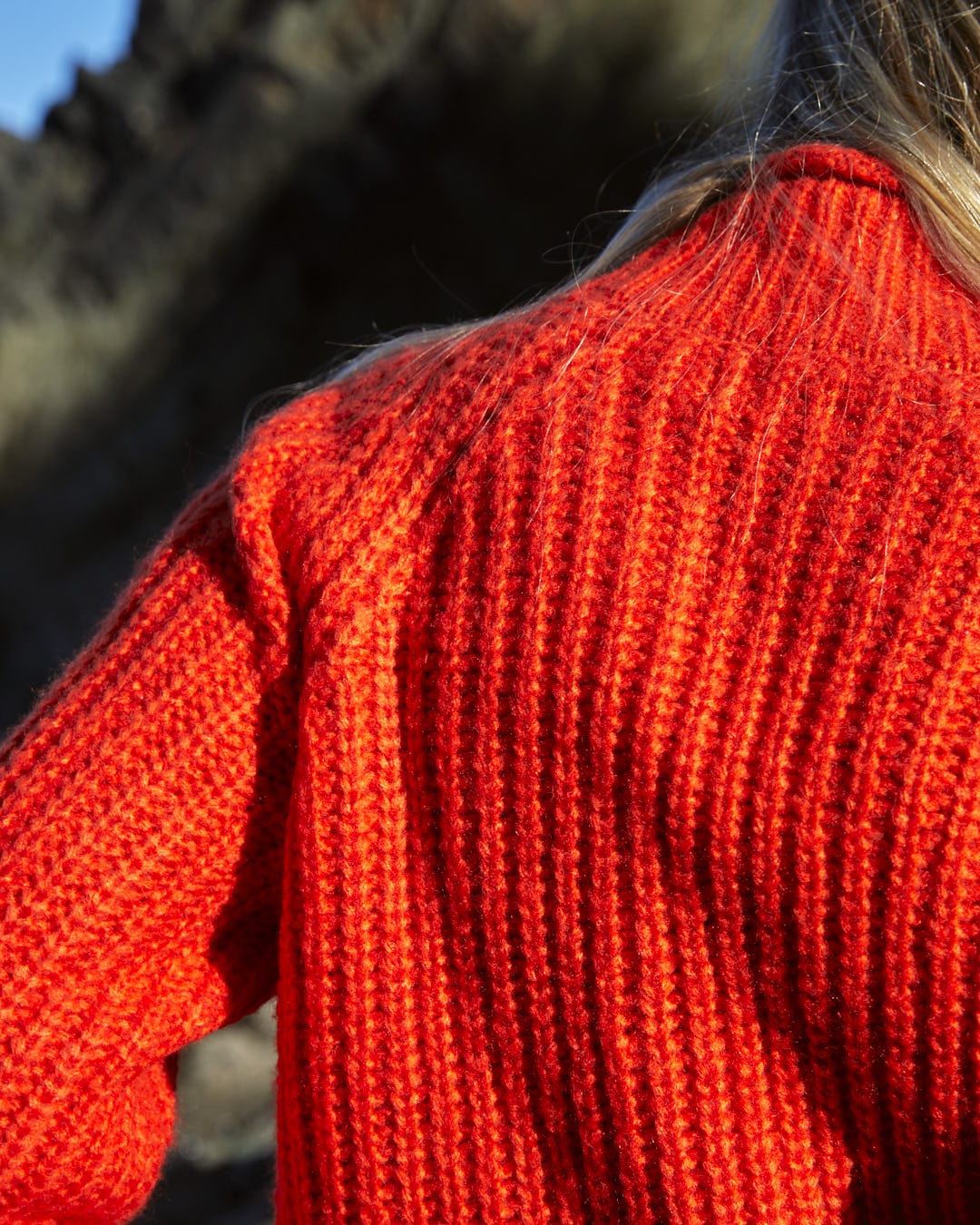 The back of a woman wearing the Saltrock Mandy - Womens Funnel Neck Jumper - Red.