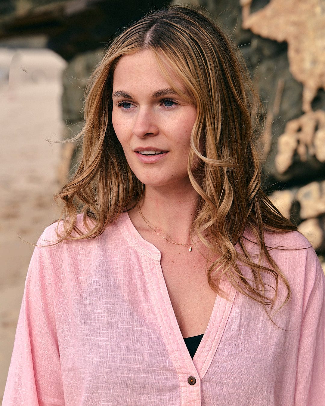 A woman wearing a Saltrock Manina - Womens Dip Die Beach Shirt - Orange.