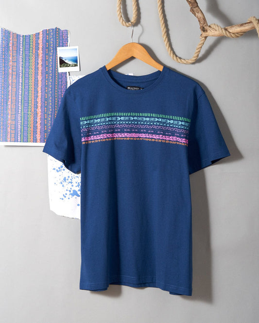 A Marks Chest - Mens Short Sleeve T-Shirt in blue with colorful stripes hanging on the wall, featuring Saltrock branding.