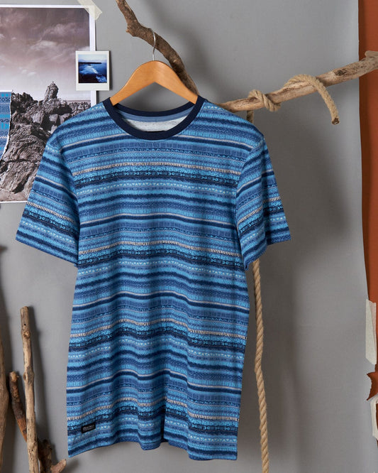 A Marks - Mens Short Sleeve T-Shirt in Blue by Saltrock hanging on a wall.