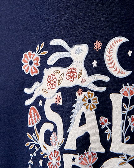 A kids' Meadow - Kids T-Shirt - Dark Blue featuring a bunny and flowers, with Saltrock branding.