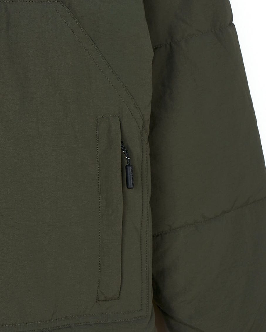 A Saltrock Merle - Womens Puffer Jacket - Dark Green with a zippered pocket.
