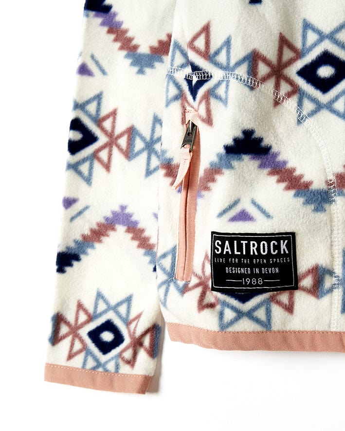A Saltrock Micro Ida - Kids Zip Fleece - Cream jacket with an Aztec print, providing warmth and comfort.