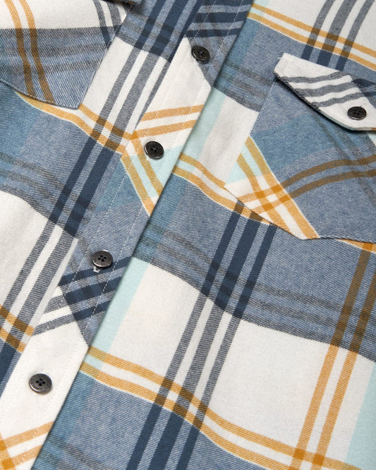 Close-up of a Saltrock Miles Men's Long Sleeve Shirt in Blue with white and yellow patterns and visible buttons.