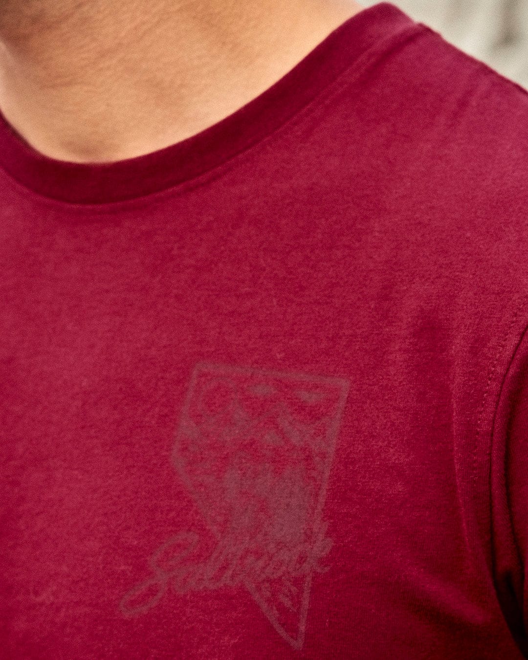 A man wearing a Saltrock - Mountain Creek - Mens Short Sleeve T-Shirt - Red.
