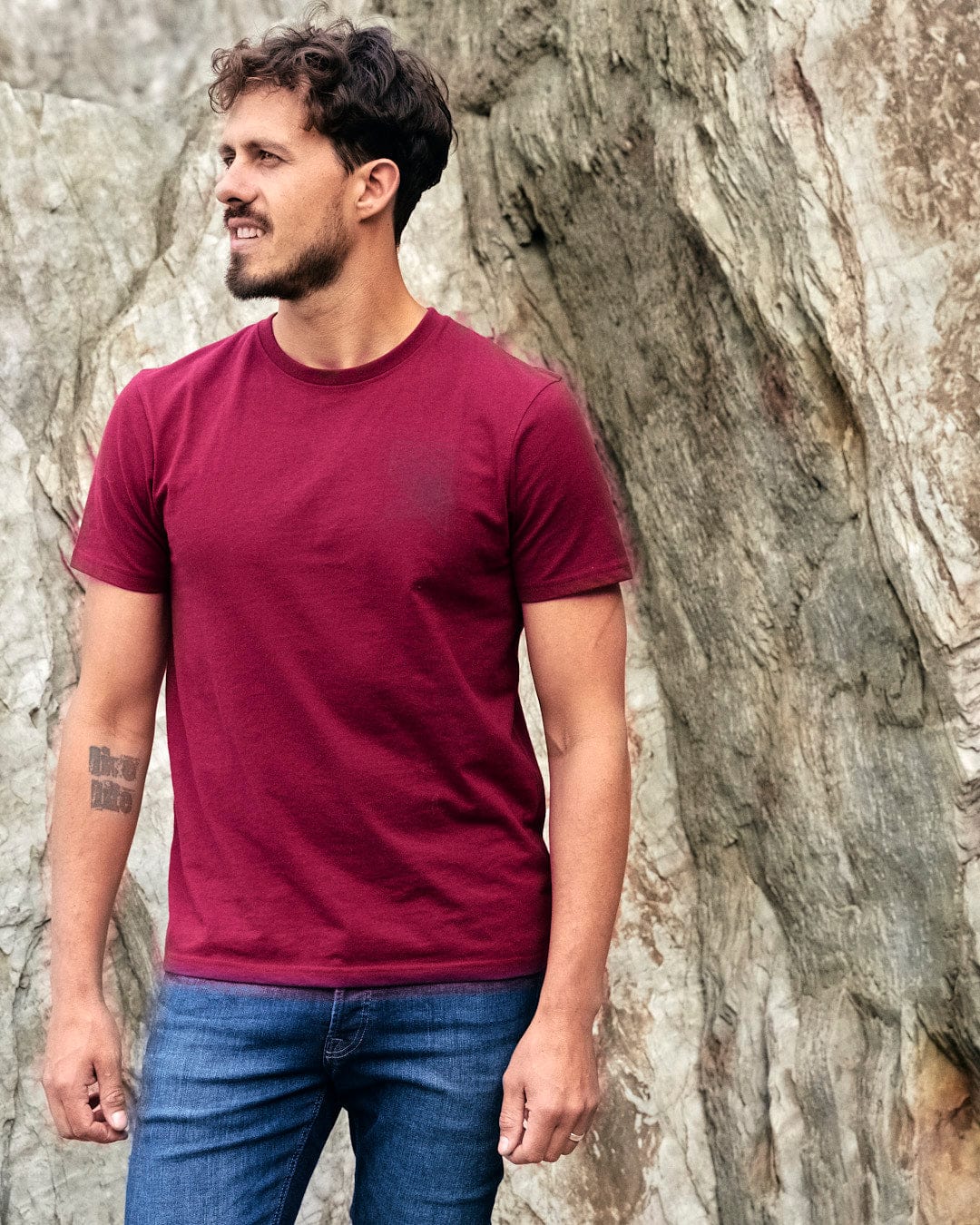 A man wearing a burgundy Saltrock - Mens Short Sleeve T-Shirt - Red.