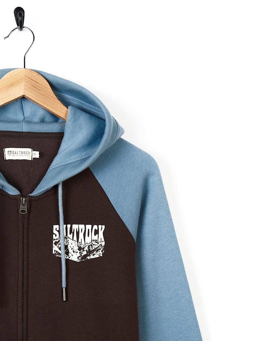 The Saltrock Mountain Roaming - Womens Raglan Zip Hoodie - Brown is a perfect choice for adventurous women seeking comfortable yet stylish attire. This hoodie features a captivating combination of blue and brown colors, with the word "stuck".