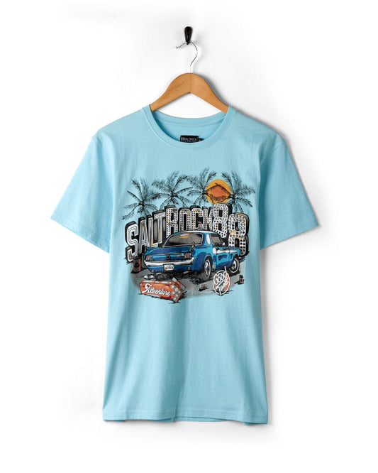 Neon Boneyard - Mens Short Sleeve T-Shirt - Light Blue made of soft peached cotton fabric with a vintage truck and palm tree graphic design hanging on a wooden hanger against a white background by Saltrock.