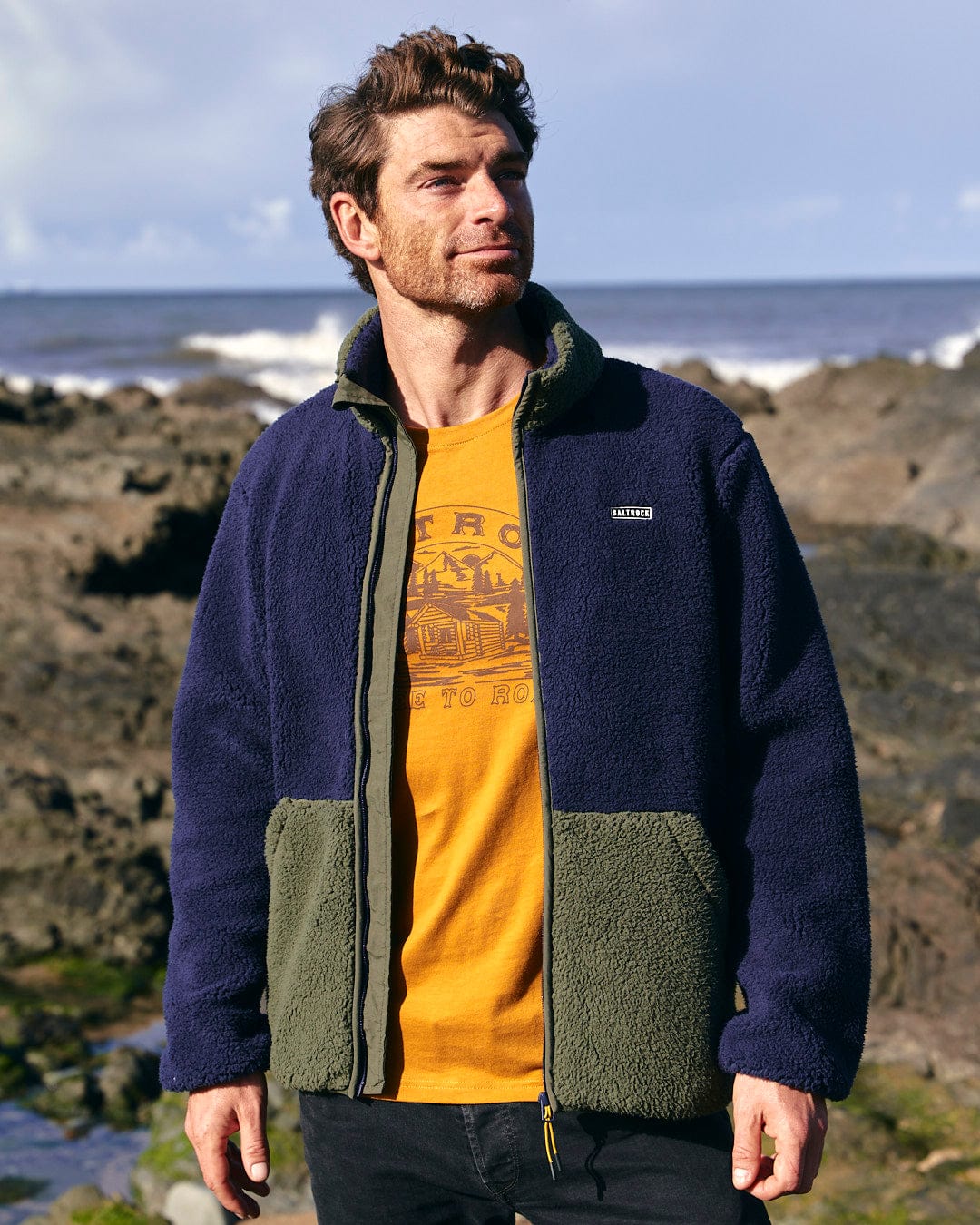 The back of a man looking at a Saltrock - Odin - Mens Zip Thru Fleece - Dark Blue.
