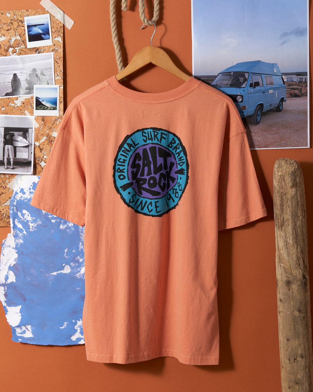 Saltrock SR Originals - Mens Short Sleeve T-Shirt in Peach hanging on a wall with coastal themed decor.