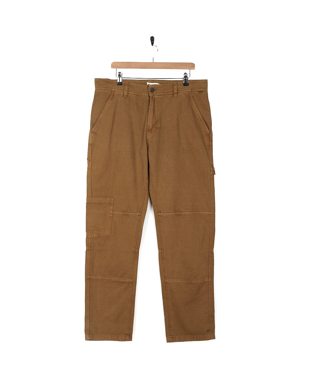 A pair of Oslo - Mens Carpenter Trousers - Brown by Saltrock with detailed stitching hanging on a hanger.