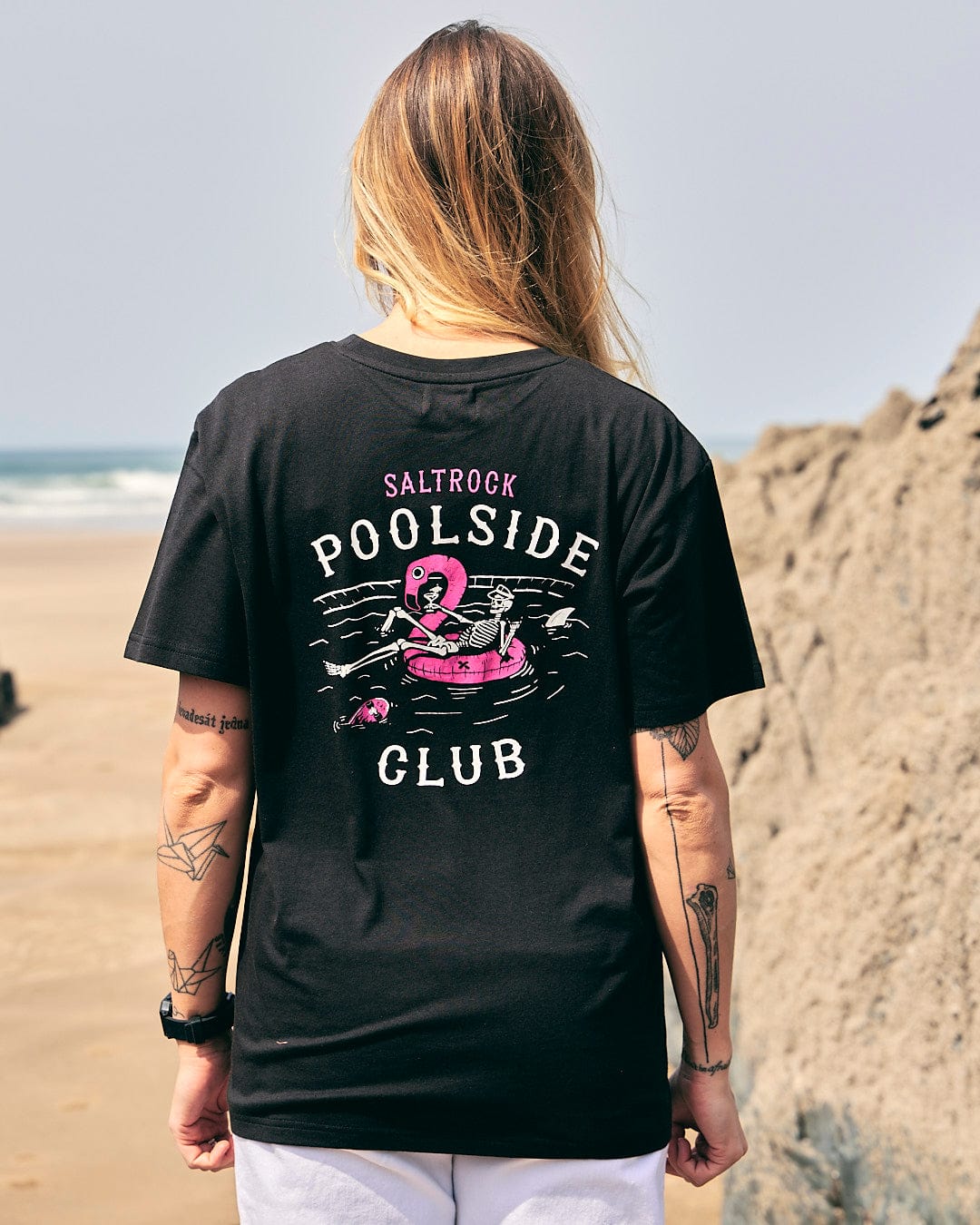 A woman wearing a Saltrock Poolside - Womens Short Sleeve T-Shirt - Black.