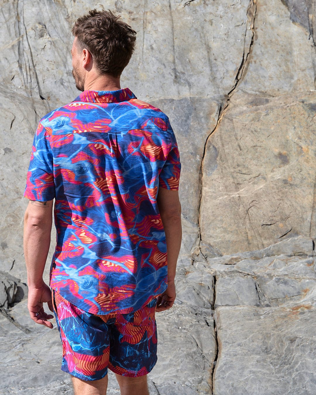 A man wearing a Saltrock - Poolside Mens Short Sleeve Shirt in Teal.