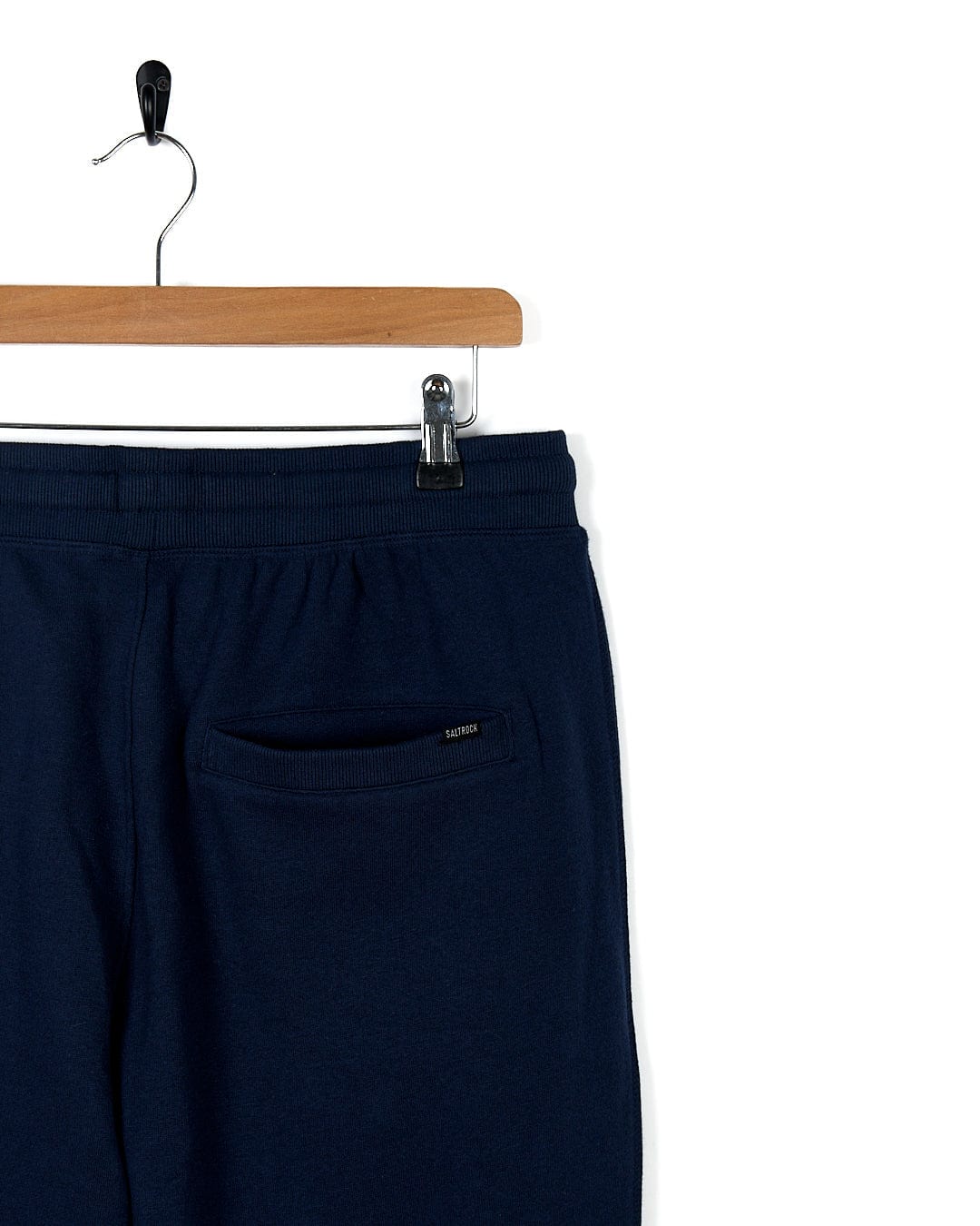 Saltrock Premium Helston - Mens Jogger - Dark Blue sweatpants hanging on a hanger, perfect for an active lifestyle.