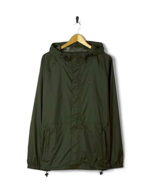 Green Saltrock Rainier Men's Packable Waterproof Jacket hanging on a wooden hanger against a white background.