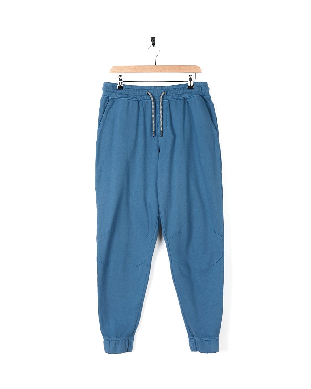 Stylish Saltrock Ralfen - Mens Slimfit Sweatpants - Blue hanging on a hanger.