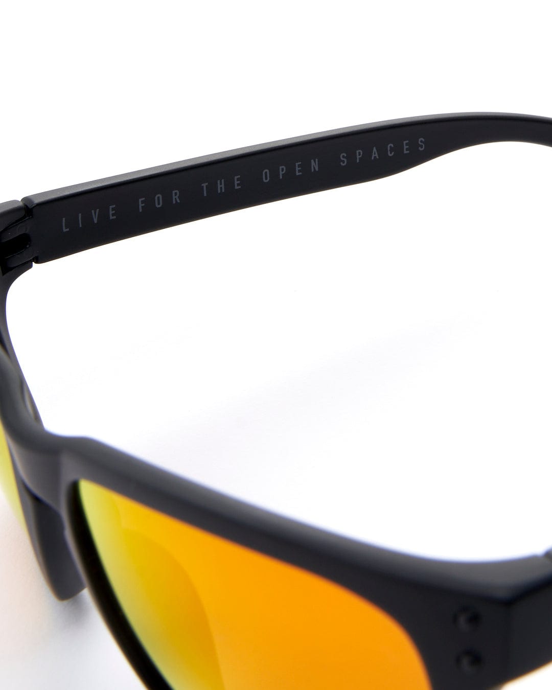 A pair of Saltrock Ranger - Recycled Polarised Sunglasses - Black with orange mirrored lenses.