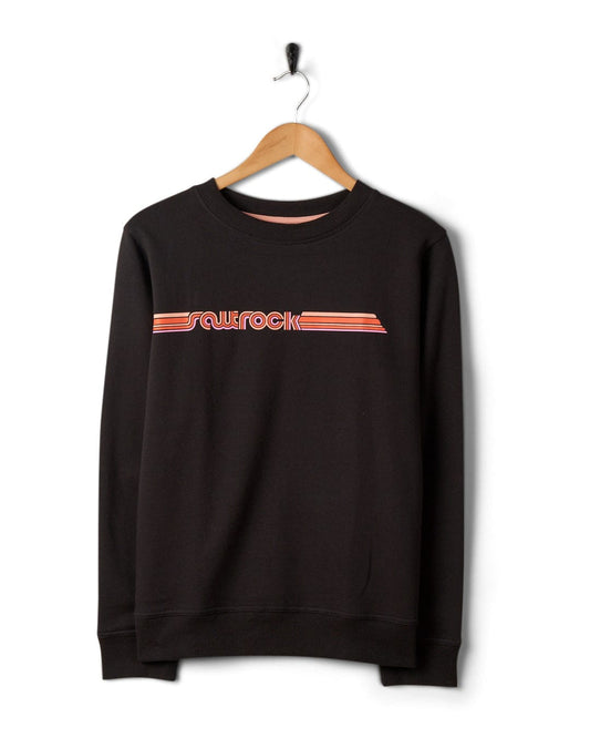Saltrock Retro Ribbon Tape - Womens Sweatshirt - Dark Grey with graphic print hanging on a hanger against a white wall.