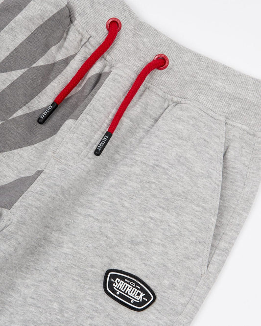 A grey Rip It - Kids Jogging Bottom with a red and grey Saltrock logo.