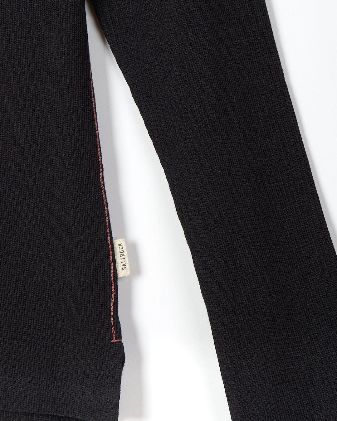 A Saltrock Rory - Womens Long Sleeve Waffle T-Shirt - Black with red stitching.