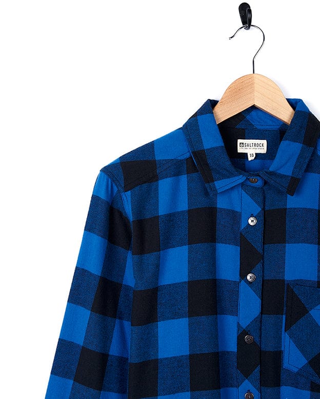 A Rosalin - Womens Check Shirt - Blue/Black by Saltrock hanging on a hanger.