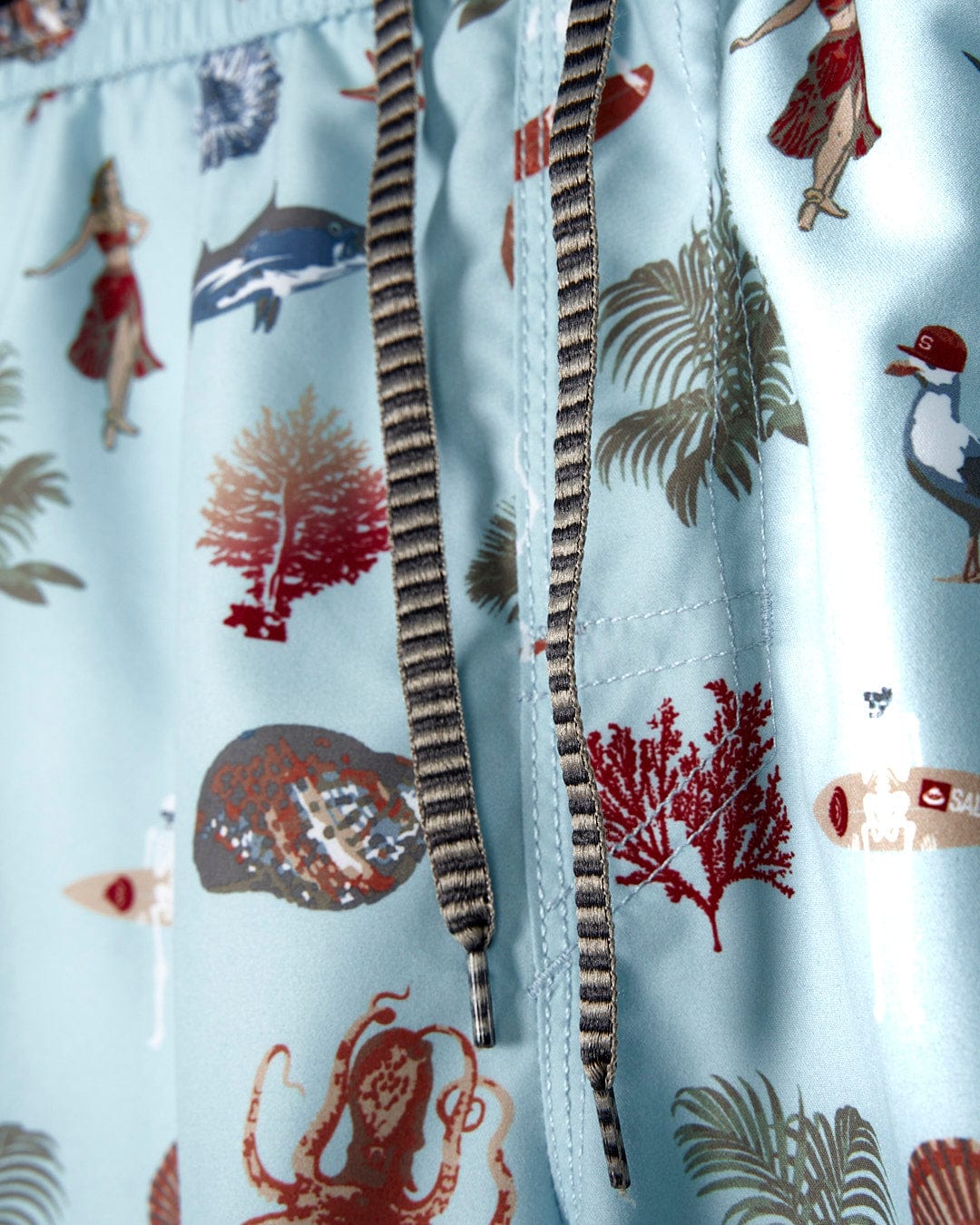 A pair of Ruan - Mens Swimshorts - Light Blue swim trunks with an octopus print from Saltrock.