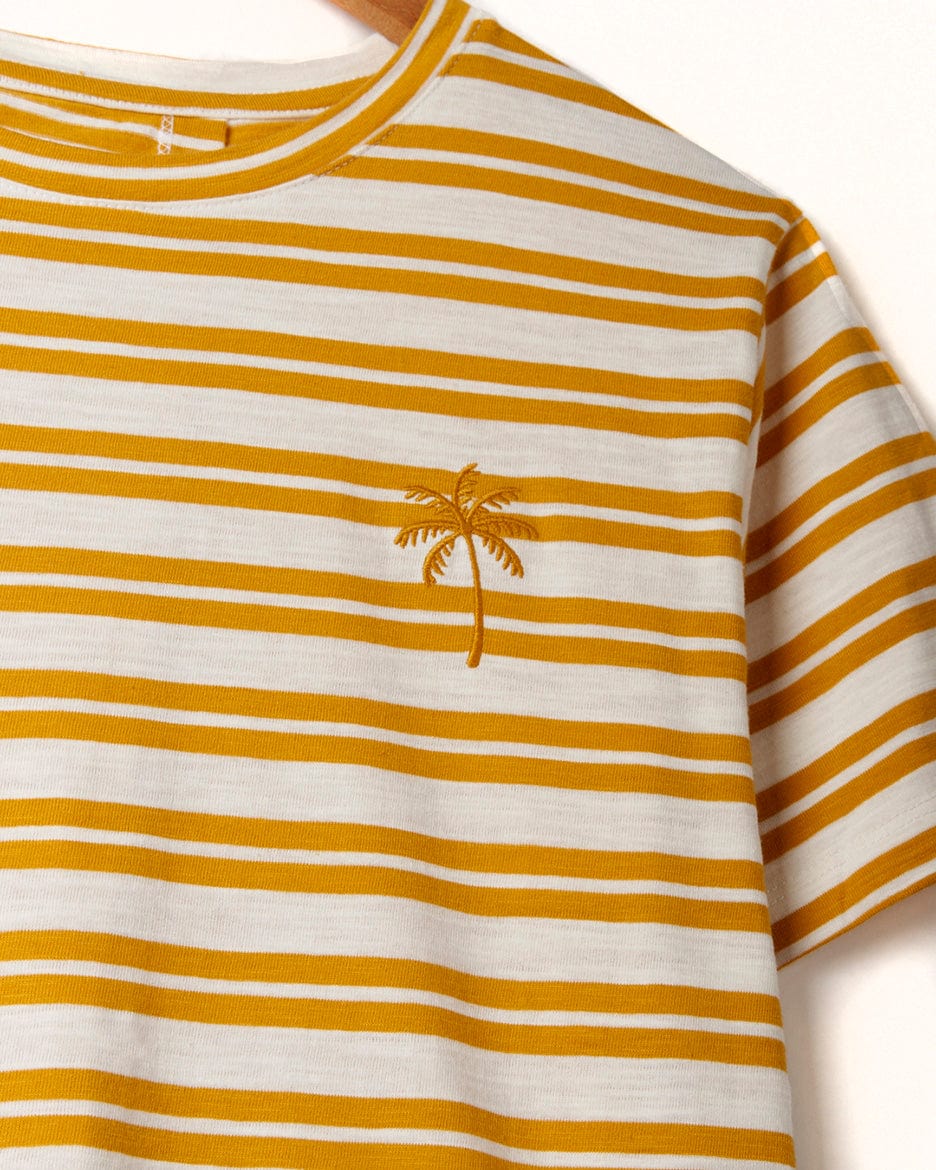 Close-up of a Saltrock Sky - Womens Short Sleeve T-Shirt - Yellow with a small embroidered palm tree on the left chest area.