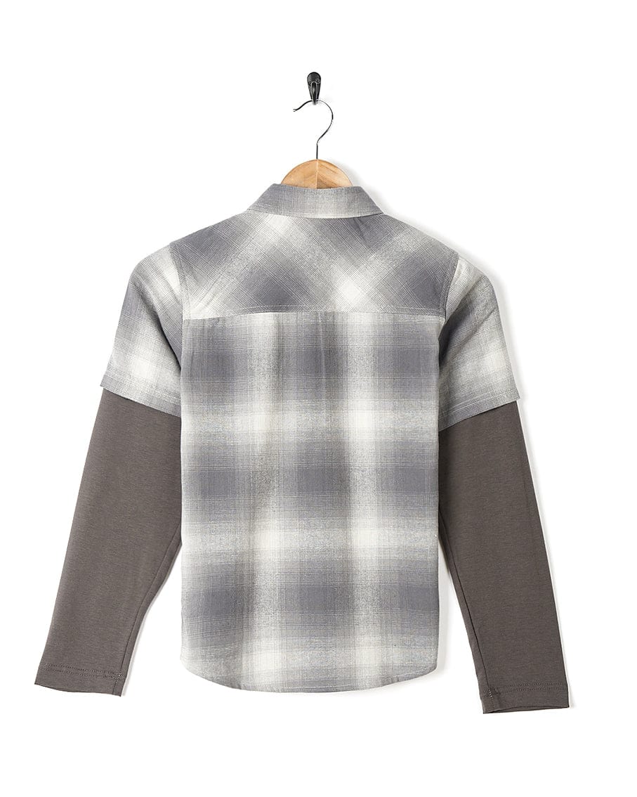 A Slacker - Kids Shirt - Grey from Saltrock hanging on a hanger.