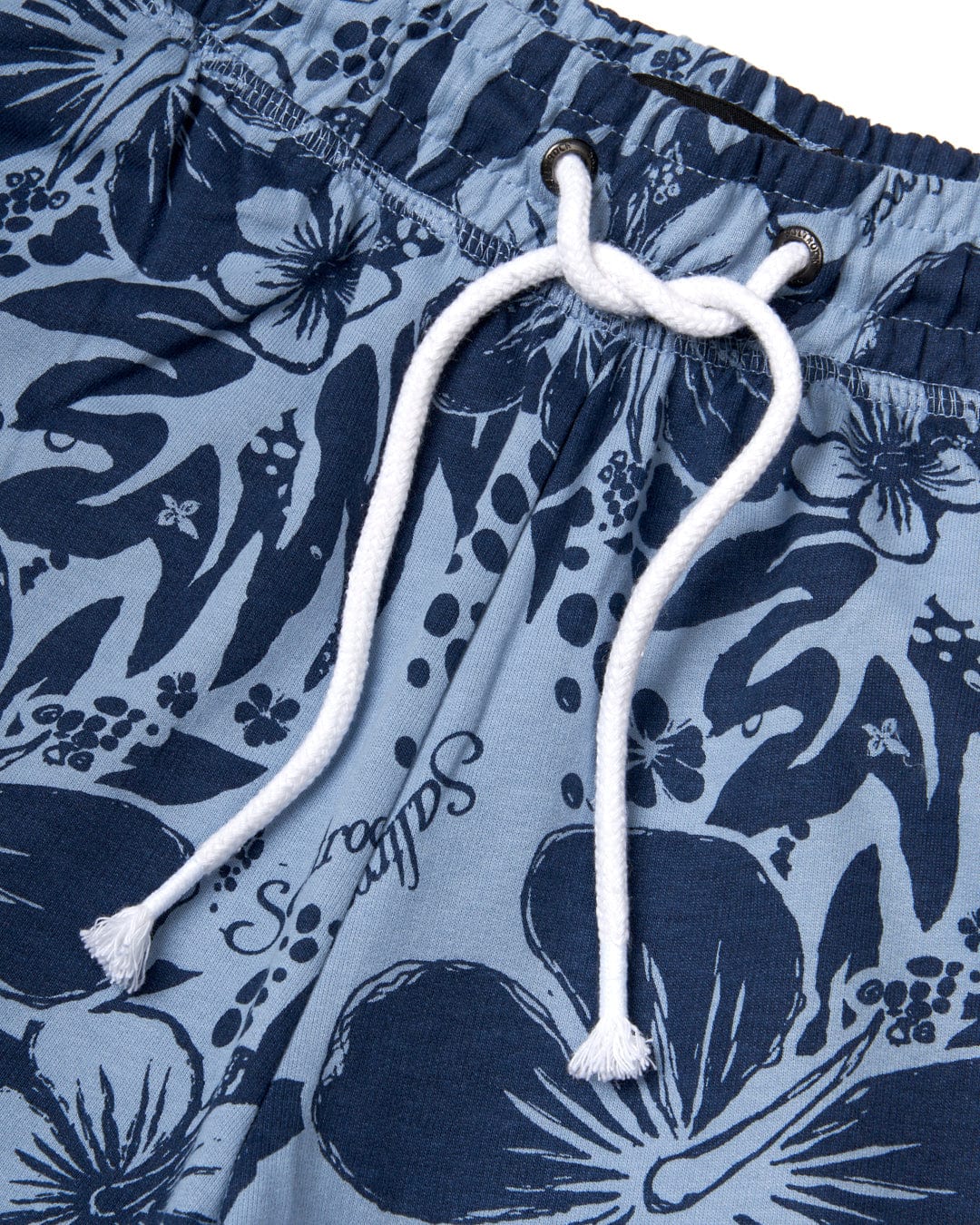A blue and white Saltrock Soifra Hibiscus print swim trunks with an elasticated waist.