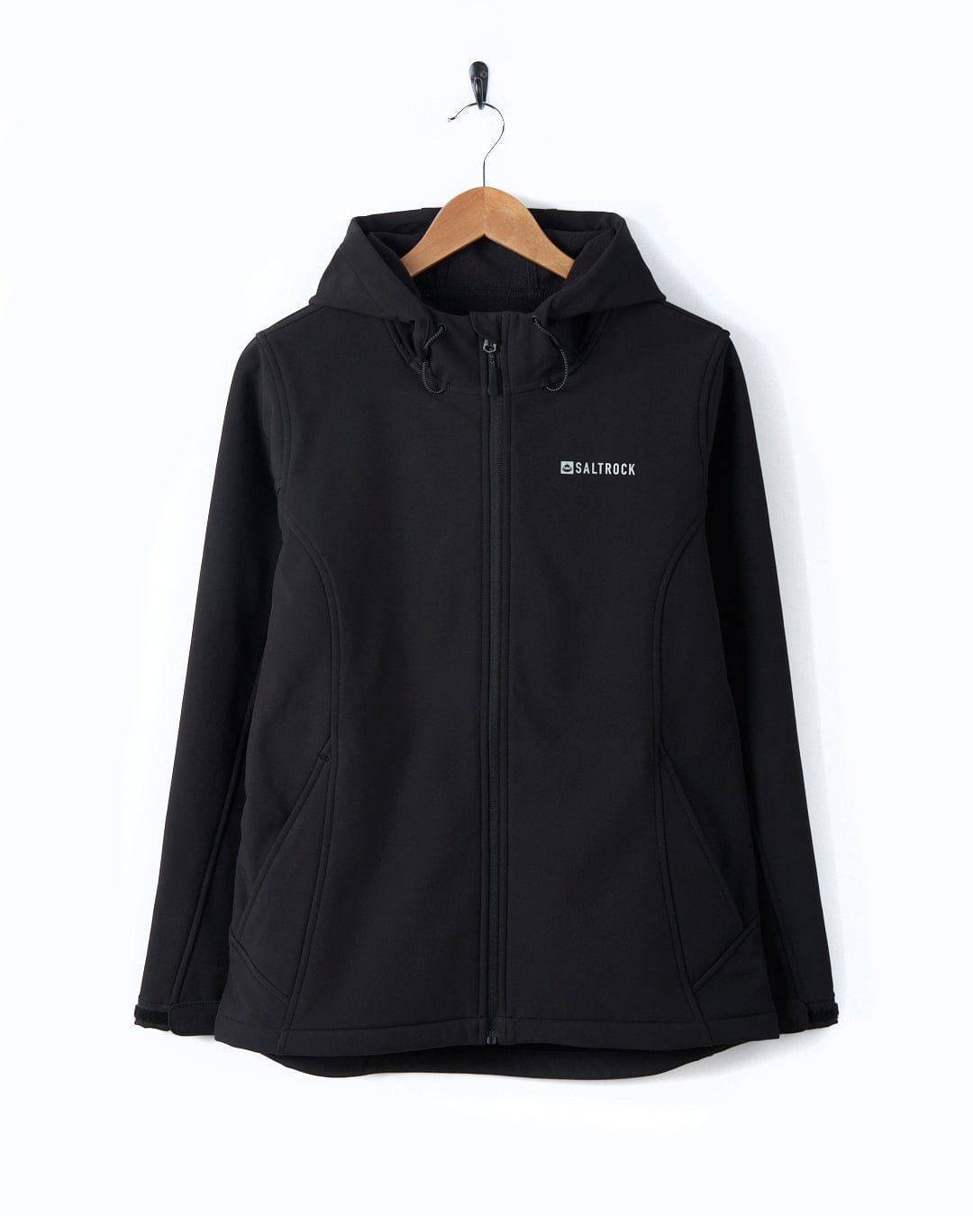 A lightweight Saltrock Solar - Womens Softshell Jacket - Black hooded jacket hanging on a hanger.