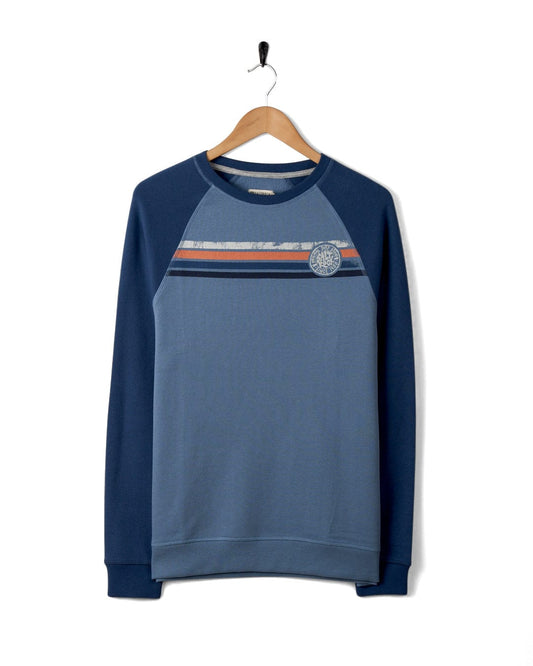 Blue Spray Stripe - Recycled Mens Sweat by Saltrock hanging on a hanger against a white background.