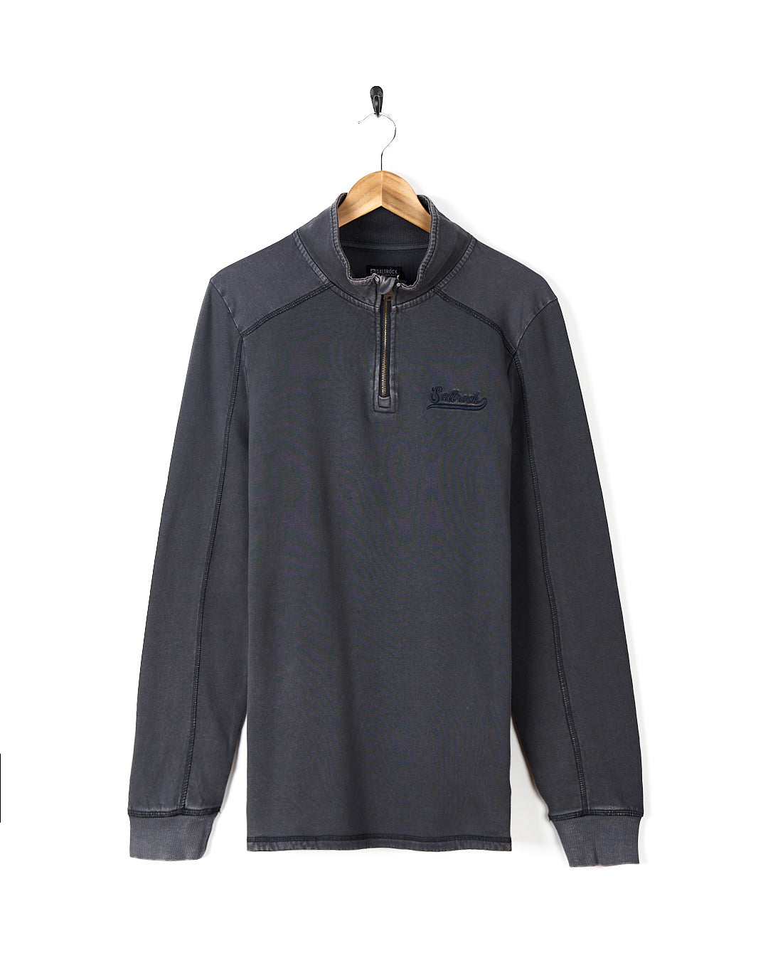 A Stellan - Mens 1/4 Neck Sweat - Grey Acid Wash sweatshirt hanging on a hanger.
Brand: Saltrock