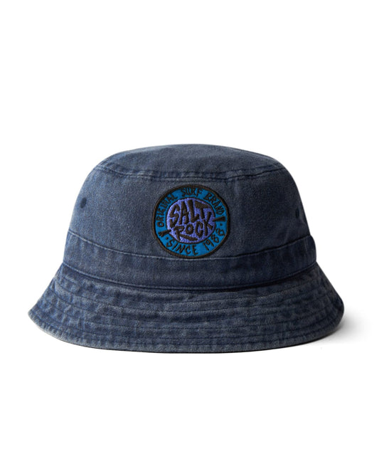 A blue cotton denim SR Original bucket hat with a colorful Saltrock badge on the front.
