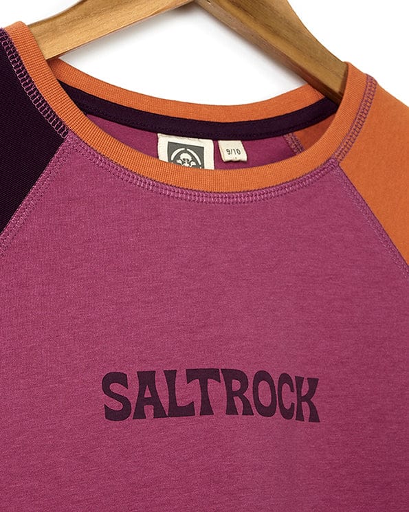 The Sunny - Kids Raglan Long Sleeve T-Shirt - Dark Pink by Saltrock is on a hanger.