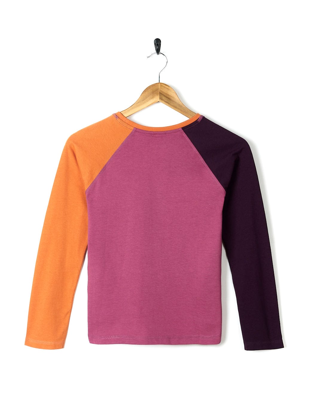 A girl's Saltrock Sunny - Kids Raglan Long Sleeve T-Shirt - Dark Pink in purple and orange.
