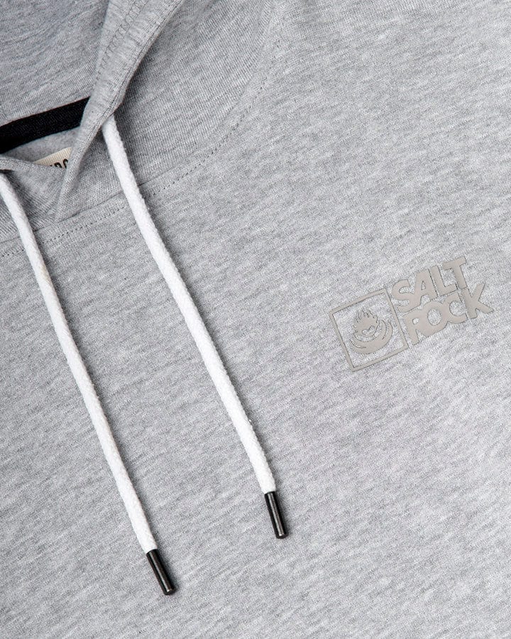 Close-up of a Saltrock Original - Mens Pop Hoodie - Grey with white drawstrings and a Saltrock branding on the left side, made from soft jersey material.