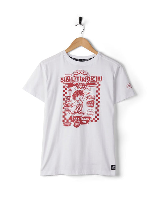 White Taco Tok - Kids Short Sleeve T-shirt with red Saltrock skateboard logo, hanging on a black hanger against a white background. The design includes text and an illustration.