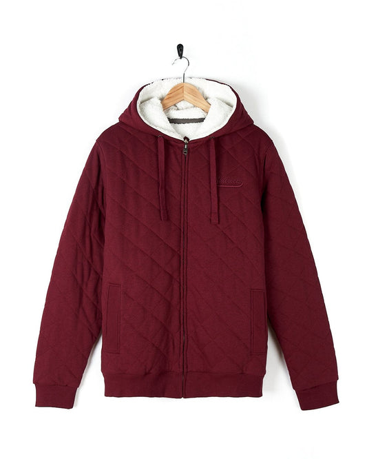 A maroon quilted Tarka - Mens Quilted Borg Lined Hoody - Red with a white hood, featuring Saltrock branding on the chest.