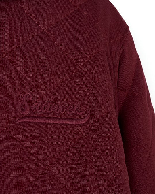 A Tarka - Mens Quilted Borg Lined Hoody - Red with the word 'sadrock' embroidered on it. The hoodie features Saltrock branding, and is made of quilted fabric for added warmth and comfort. Perfect for those.