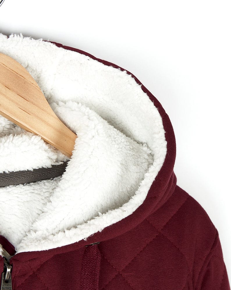 Red Saltrock Tarka - Mens Quilted Borg Lined Hoody hanging on a hanger with Saltrock branding.