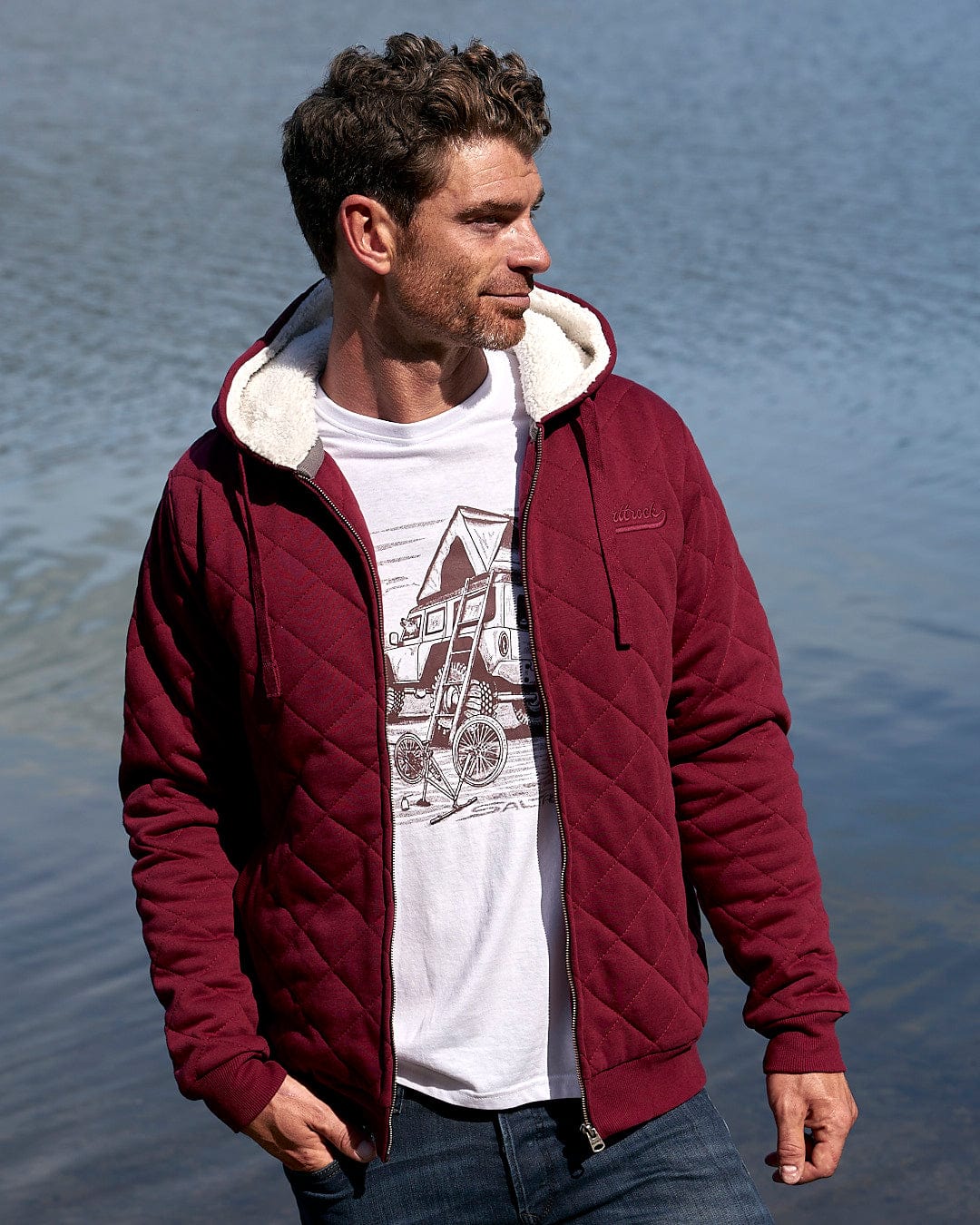 A man wearing a Saltrock Tarka - Mens Quilted Borg Lined Hoody - Red jacket.